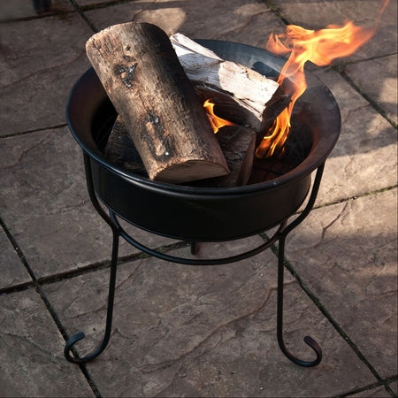 black fire pit on stand 