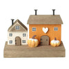 Decorative house set with pumpkins on a white background