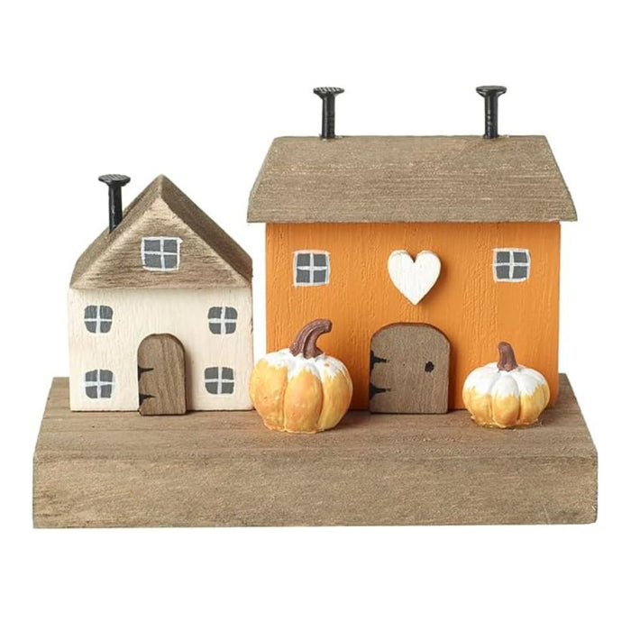 Decorative house set with pumpkins on a white background