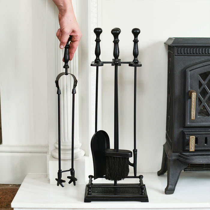 Black Fireside Tools Set In Situ With Hand For Scale 
