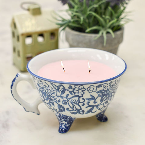 Lit Candle in Ceramic Patterned Teacup 