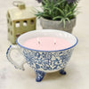 Lit Candle in Ceramic Patterned Teacup 