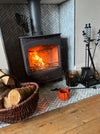 Checkered Fireside Tools Next to Log Burner 