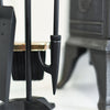 Close Up of Three Fireside Tools With Gold Shovel