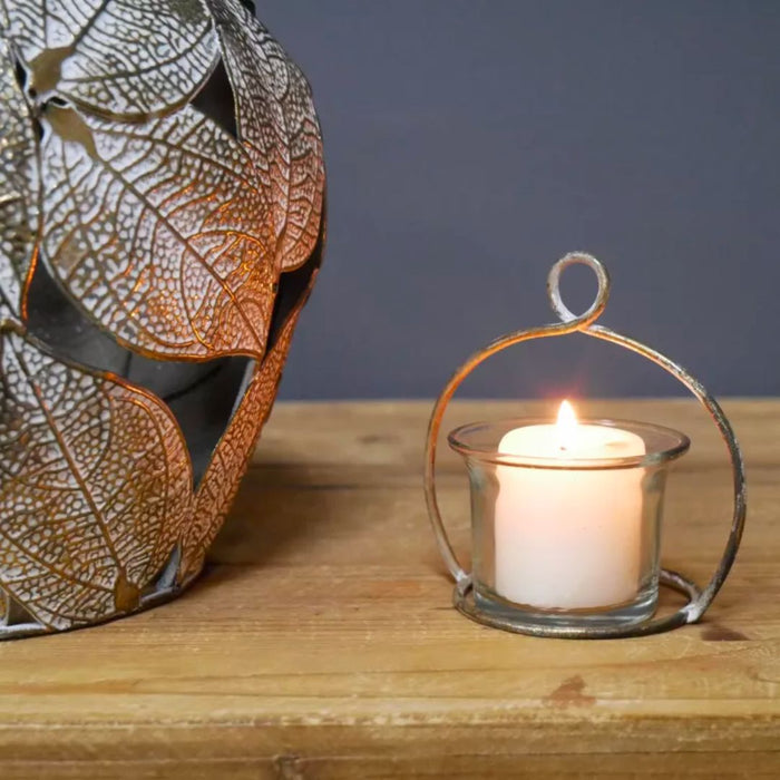 Close up of apple candle holder and lit  candle 