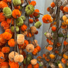 Decorative arrangement of pumpkins and gourds with a neutral background