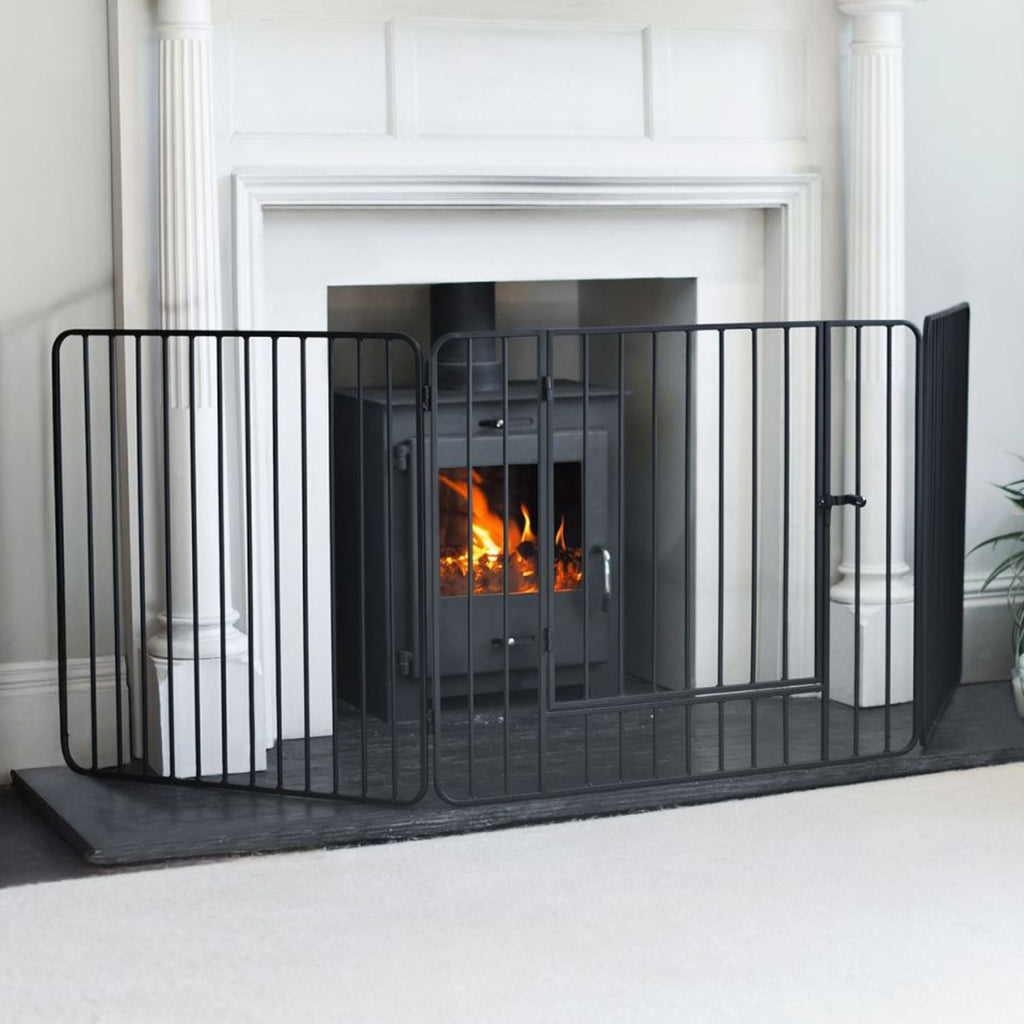 Black Nursery Guard in front of roaring fire
