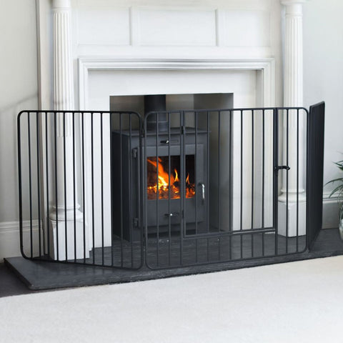 Black Nursery Guard in front of roaring fire